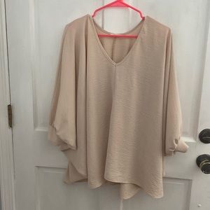 Oversized blouse in a beautiful oatmeal color. Great for work or church